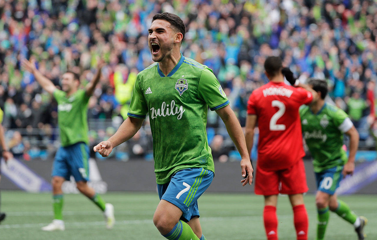 Sounders midfielder Cristian Roldan celebrates after he scored a goal against Toronto FC during the second half of an MLS match on April 13, 2019, in Seattle. (AP Photo/Ted S. Warren)