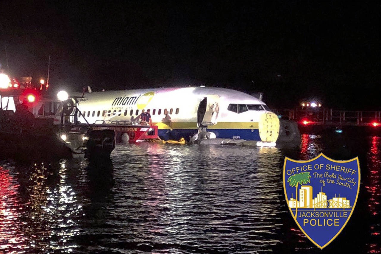 Authorities work at the scene of a plane in the water in Jacksonville, Florida, on Friday. (Jacksonville Sheriff’s Office via AP)
