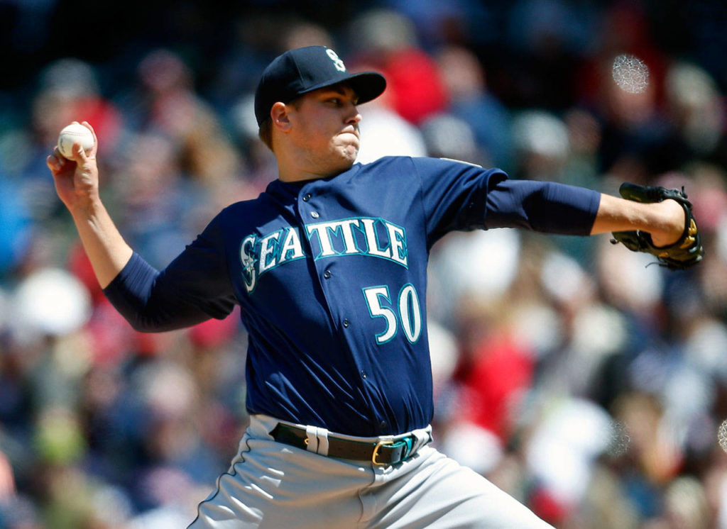 Seattle starting pitcher Erik Swanson picked up his first win of the season Sunday. He took a no-hitter into the sixth inning in the Mariners’ 10-0 win over Cleveland. (AP Photo/Ron Schwane)
