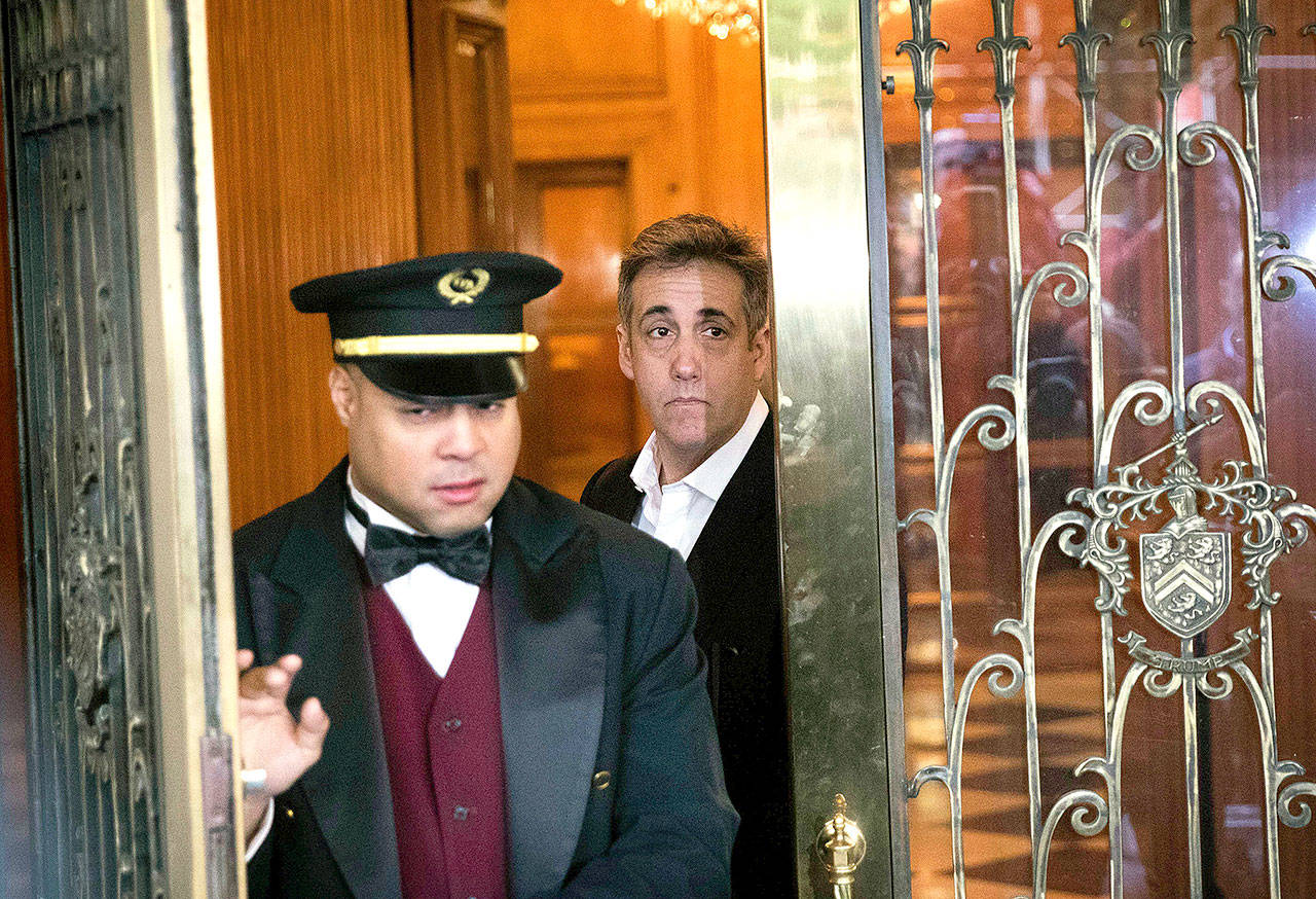Michael Cohen, former attorney to President Donald Trump, leaves his apartment building Monday in New York before beginning his prison term. (AP Photo/Kevin Hagen)