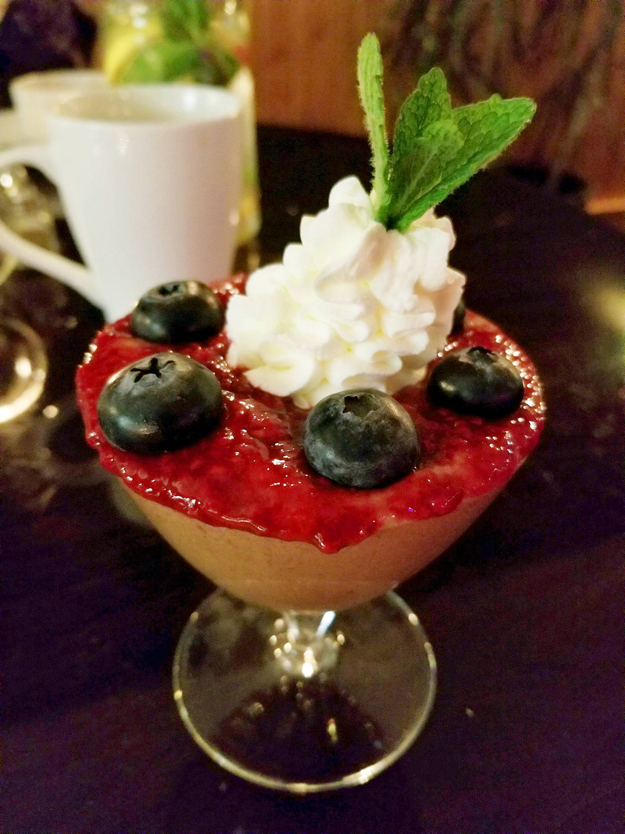 The chocolate mousse at Crow Island Farms is layered with orange whip and berry coulis, then garnished with fresh berries and mint. (Pam Bruestle)