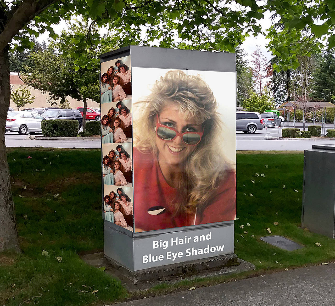This photo illustration is a mockup of what the traffic signal box might look like for Lynnwood’s “Big Hair and Blue Eye Shadow” photo contest to art up a box near the Alderwood mall. That’s Shannon Sessions, Lynnwood city councilwoman, in her 1988 Meadowdale High School graduation photo. (City of Lynnwood)