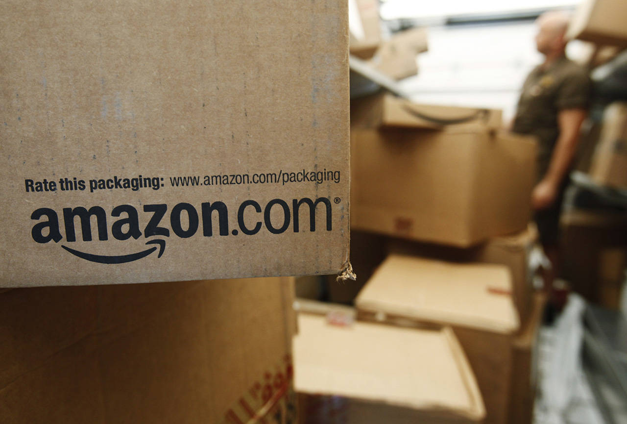 In this 2010 photo, an Amazon.com package awaits delivery from UPS in Palo Alto, California. (AP Photo/Paul Sakuma, File)