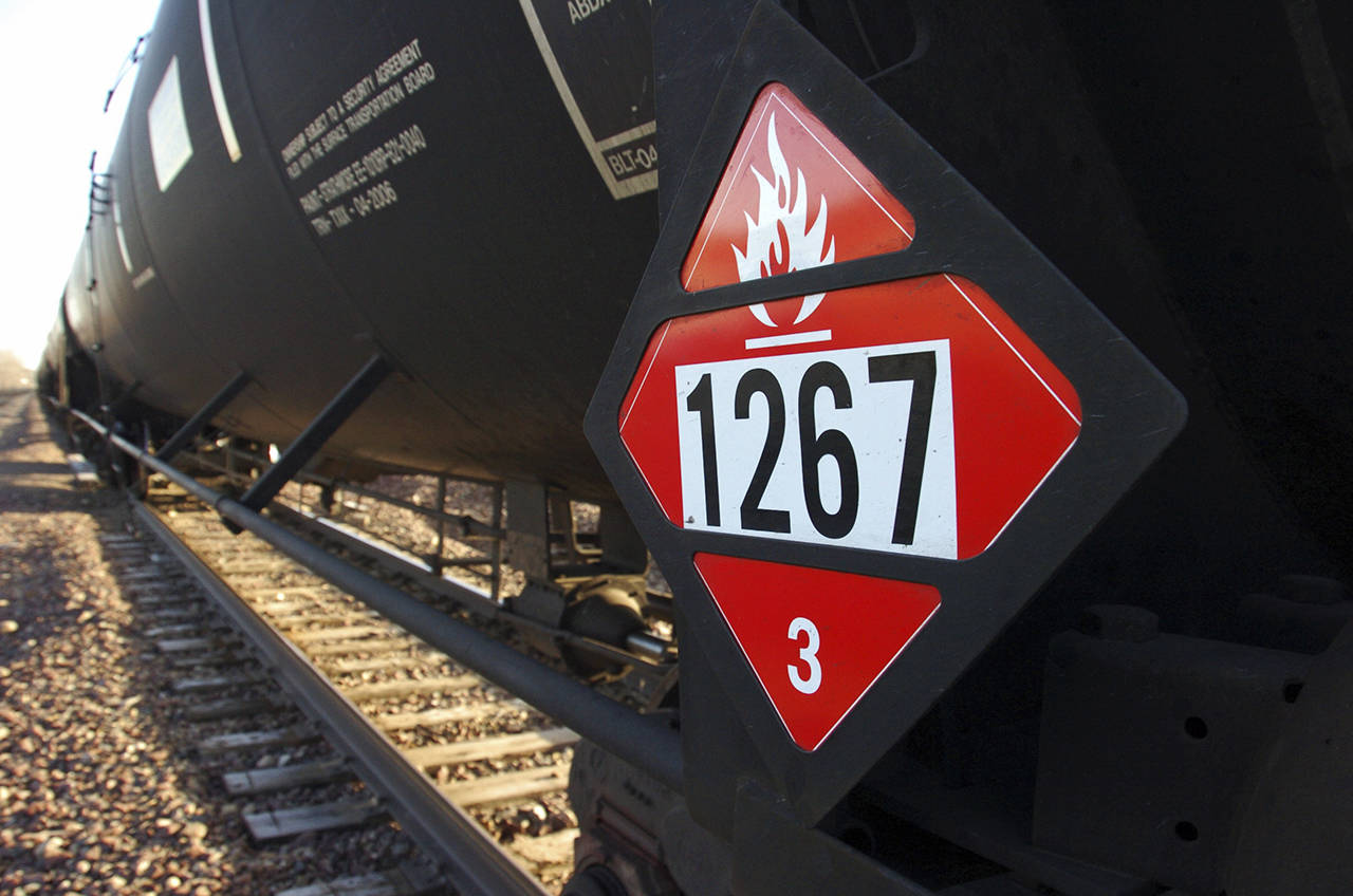 This 2013 photo shows a warning placard on a tank car carrying crude oil near a loading terminal in Trenton, North Dakota. (AP Photo/Matthew Brown, File)