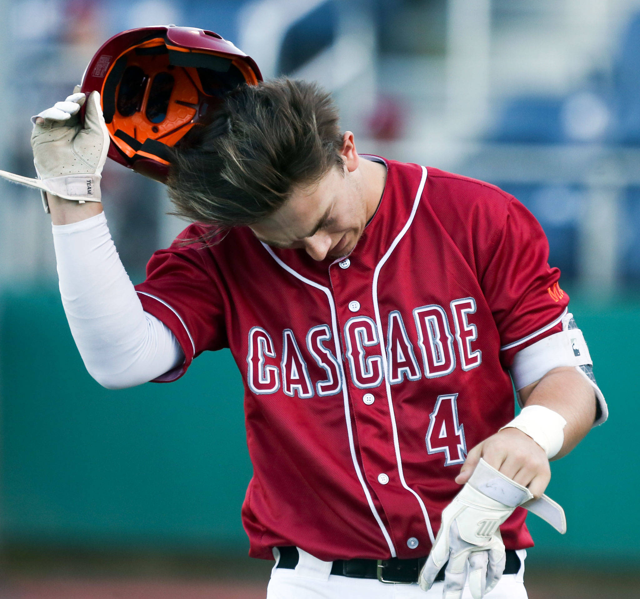 Cascade’s Jacob Sesso walks off the field between innings during the Bruins’ 6-2 loss to Eastlake in a winner-to-state Class 4A Wes-King Bi-District Tournament game Friday at Funko Field at Everett Memorial Stadium. (Kevin Clark / The Herald)