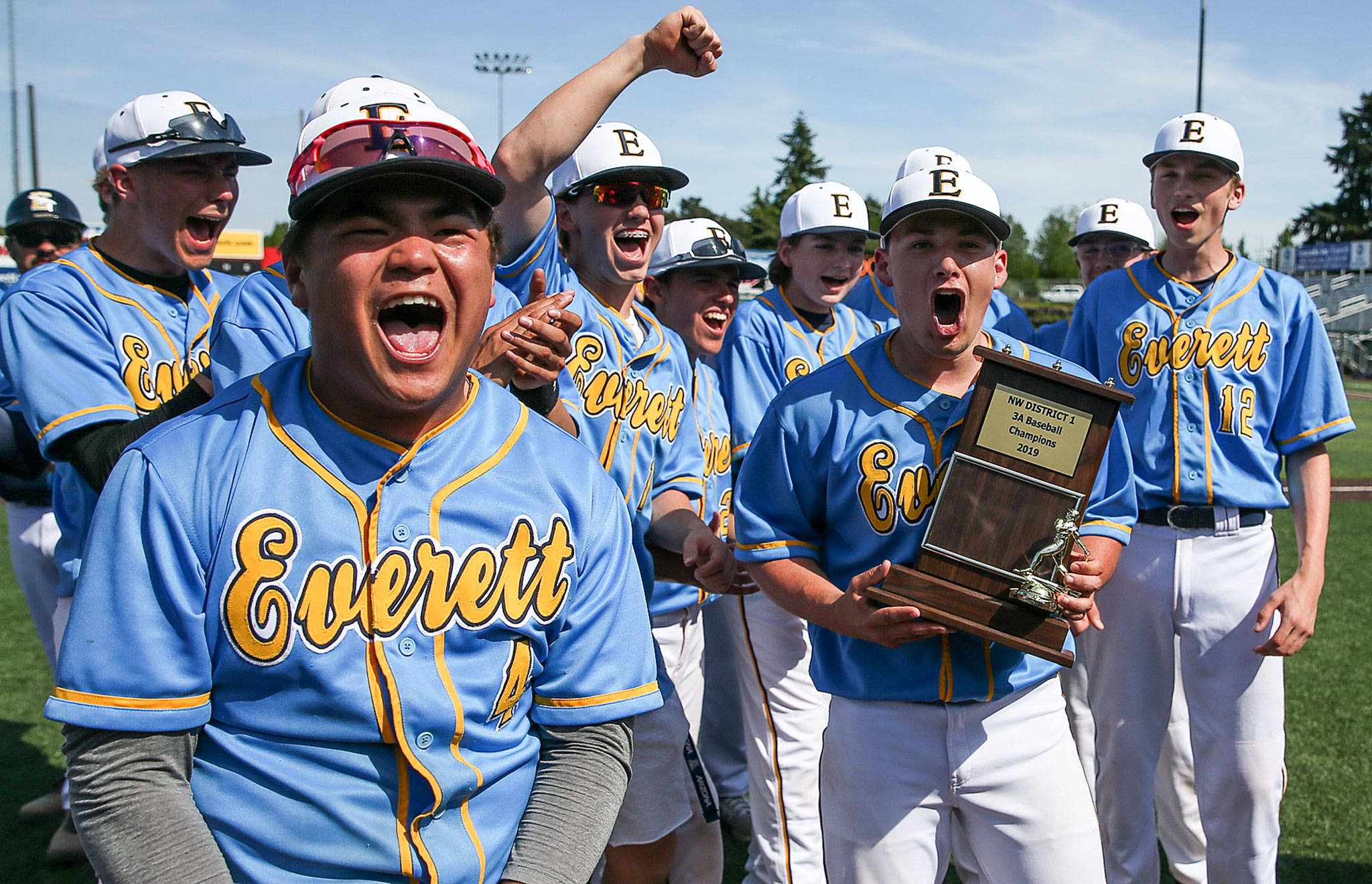 Everett players celebrate their victory over Shorewood in the 3A District 1 Tournament championship game on May 11, 2019, at Funko Field at Everett Memorial Stadium. The Seagulls won 6-0. (Kevin Clark / The Herald)