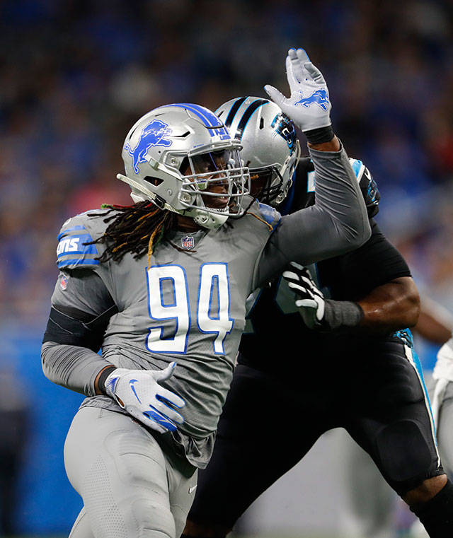 Ezekiel Ansah (94) sheds a block during a game between the Lions and Panthers on Nov. 18, 2018, in Detroit. Ansah officially signed a one-year deal with the Seahawks on Friday. (AP Photo/Paul Sancya)