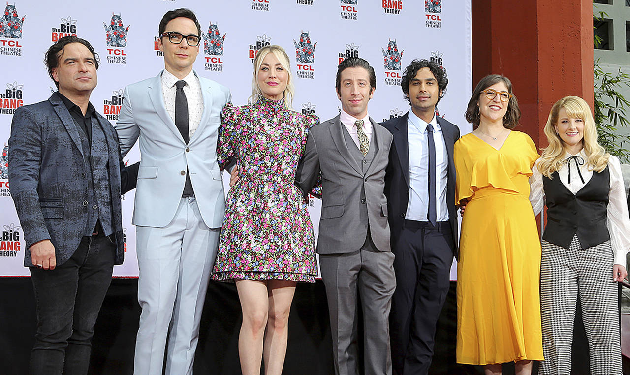 Johnny Galecki (from left), Jim Parsons, Kaley Cuoco, Simon Helberg, Kunal Nayyar, Mayim Bialik and Melissa Rauch, cast members of the TV series “The Big Bang Theory,” pose at a hand and footprint ceremony at the TCL Chinese Theatre on May 1 in Los Angeles. (Photo by Willy Sanjuan/Invision/AP)