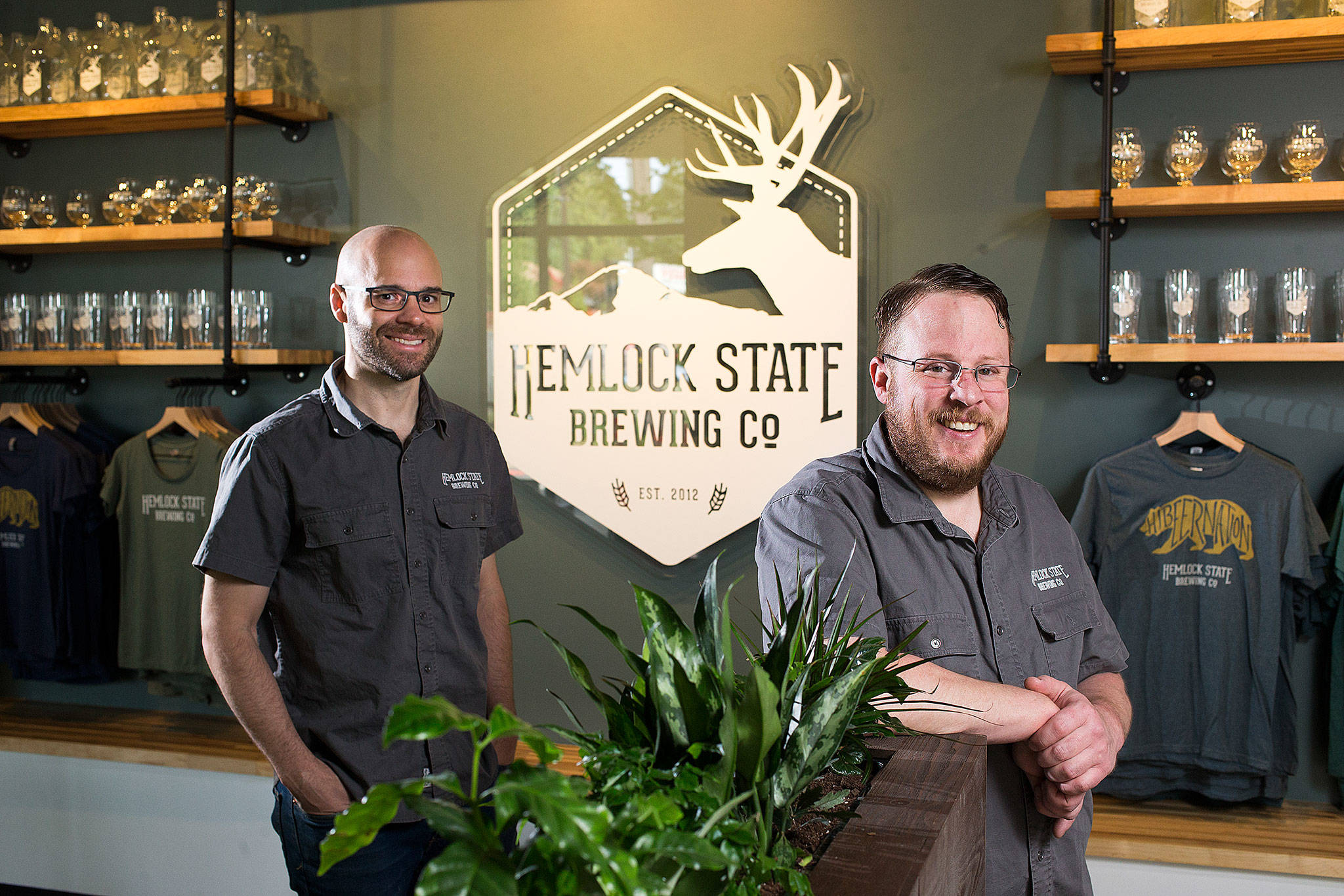 Co-owners Jerret Botch and Michael Ernst, left, at Hemlock State Brewing Co. on Wednesday, May 15, 2019 in Mountlake Terrace, Wash. (Andy Bronson / The Herald)