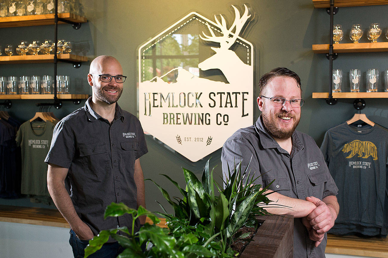 Co-owners Jerret Botch and Michael Ernst, left, at Hemlock State Brewing Co. on Wednesday, May 15, 2019 in Mountlake Terrace, Wash. (Andy Bronson / The Herald)