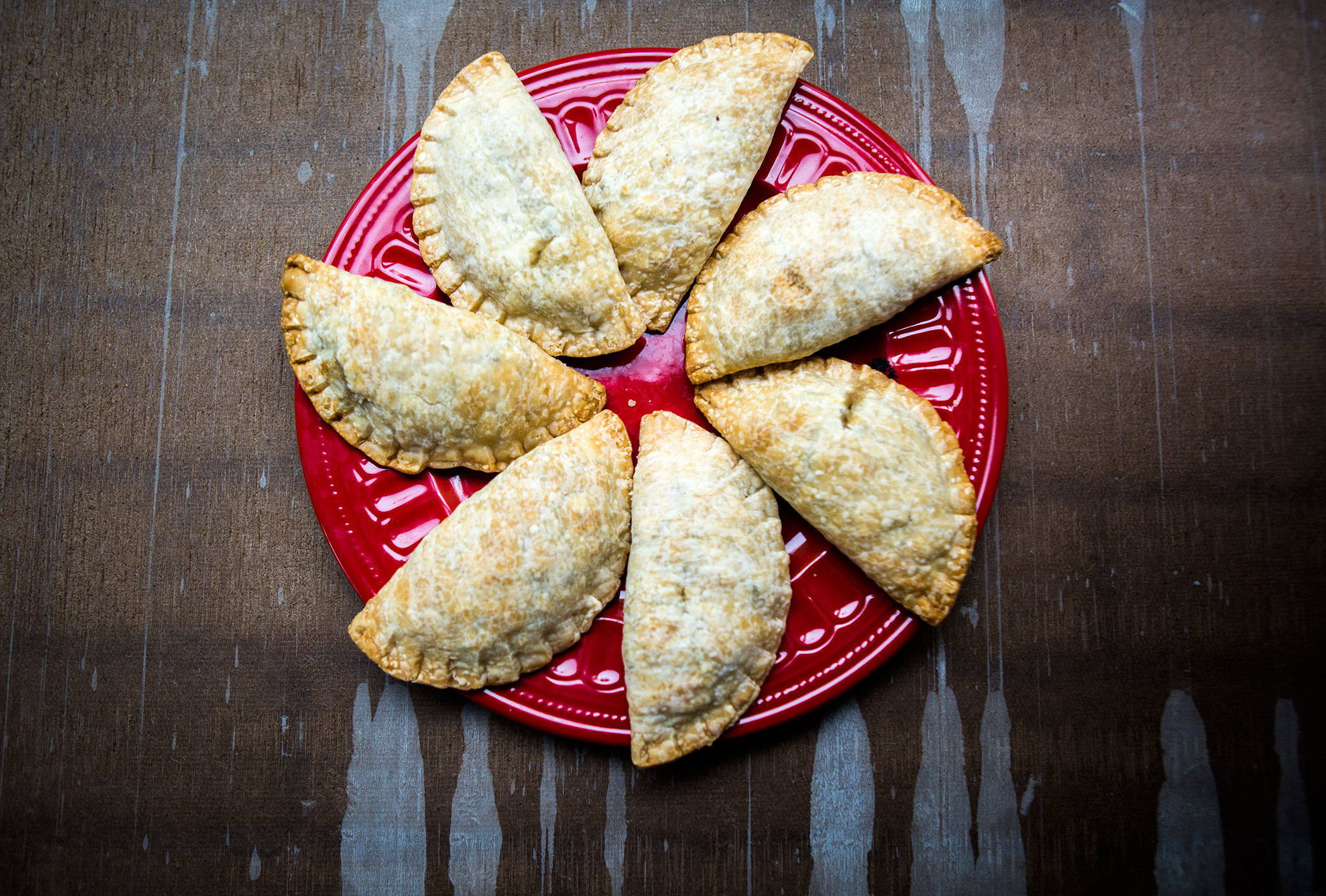 This plate of poblano and corn hand pies would have benefitted from a brown-inducing egg wash before baking. Still, Herald taste-testers gave them thumbs up. (Olivia Vanni / The Herald)