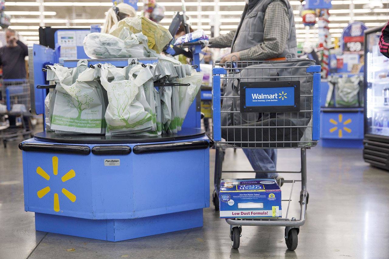 A customer purchases groceries at a Walmart store in Burbank, California. (Bloomberg photo by Patrick T. Fallon)