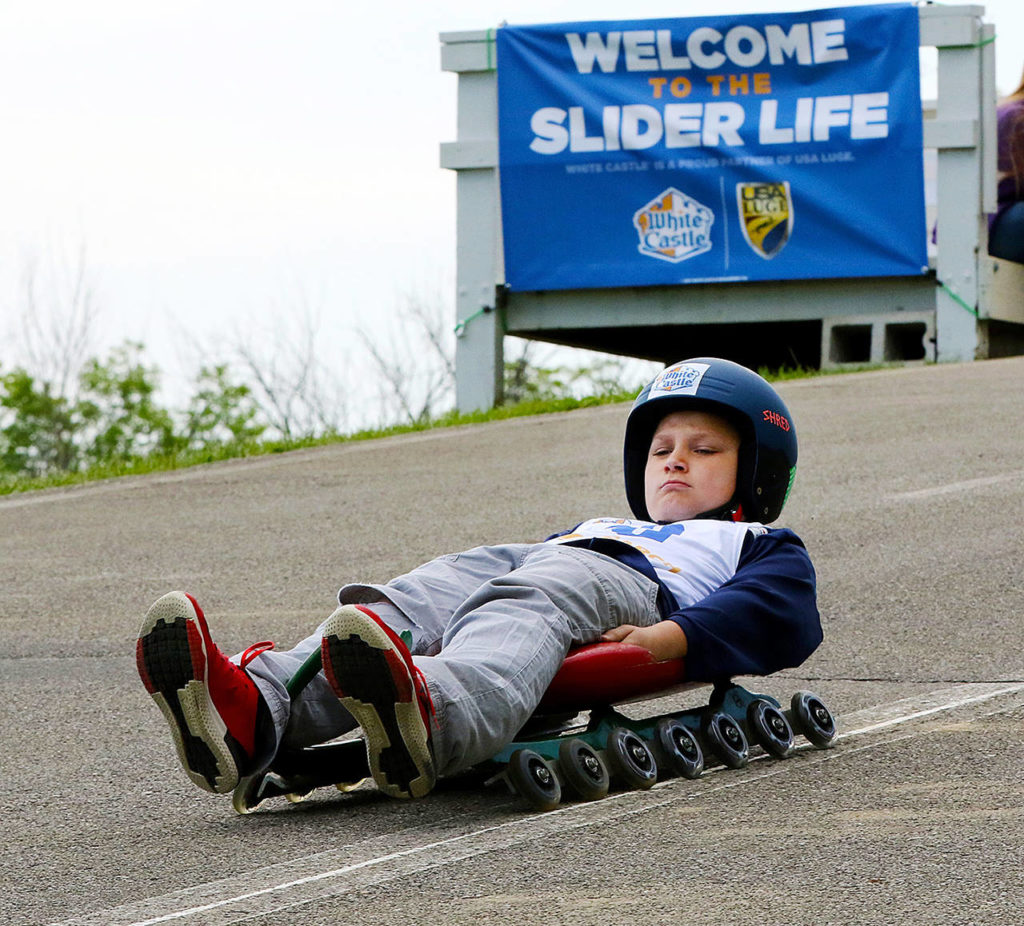 Children can try out luge, the winter sport, this weekend on Camano Island. They’ll use sleds with wheels attached to slide down pavement at slower speeds than is usual in the sport. (USA Luge)
