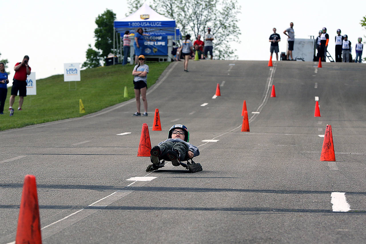 Children can try out luge, the winter sport, this weekend on Camano Island. They’ll use sleds with wheels attached to slide down pavement at slower speeds than is usual in the sport. (USA Luge)