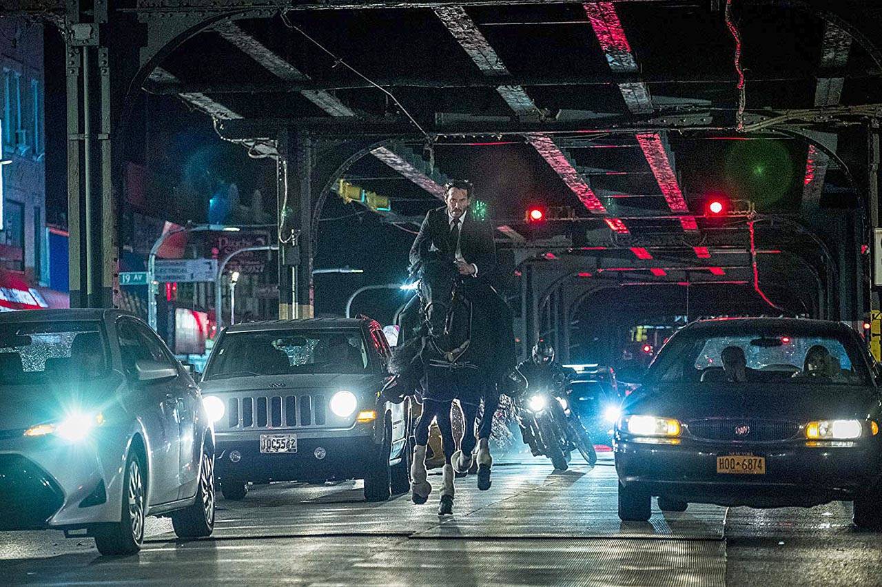 When he’s not crunching skulls, Keanu Reeves rides tall in the saddle in “John Wick: Chapter 3 — Parabellum.” (Lionsgate)
