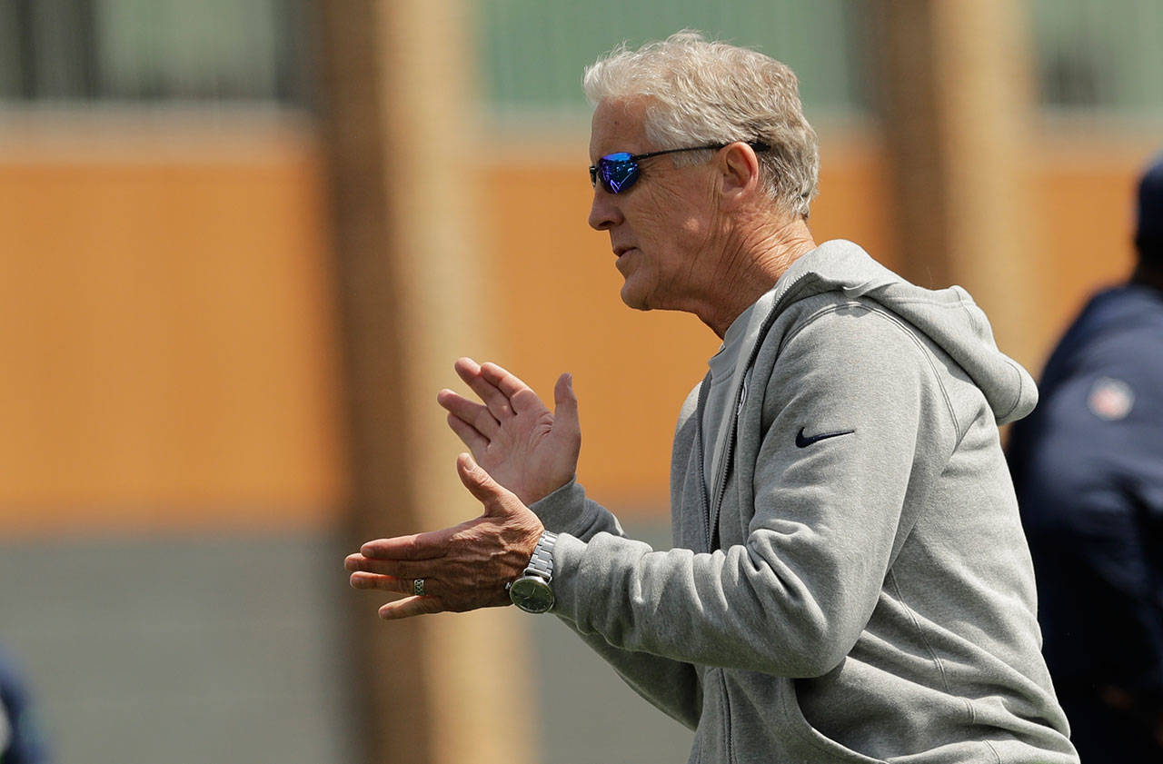 Seahawks head coach Pete Carroll encourages players on the first day of rookie minicamp on May 3, 2019, in Renton. (AP Photo/Ted S. Warren)