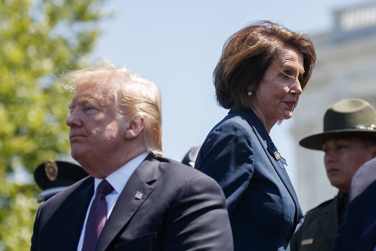 President Donald Trump and Speaker of the House Nancy Pelosi attend the 38th Annual National Peace Officers’ Memorial Service at the U.S. Capitol on Wednesday in Washington. Pelosi said Wednesday that the U.S. must avoid war with Iran and she warned the White House has “no business” moving toward a Middle East confrontation without approval from Congress. (AP Photo/Evan Vucci)