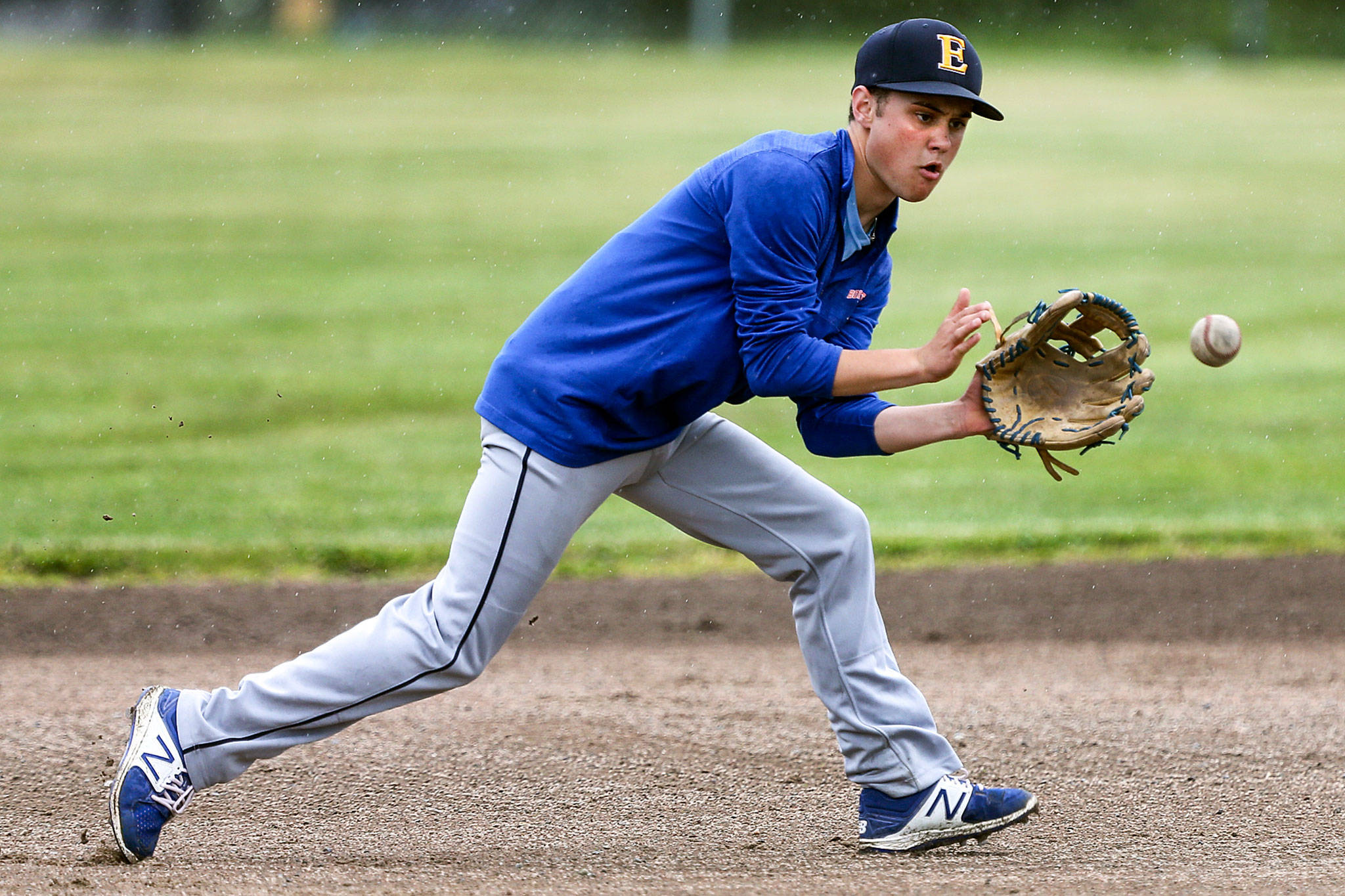 Everett’s Ethan Pewitt fields a ground ball during practice on May 16 at Cascade High School in Everett. (Kevin Clark / The Herald)