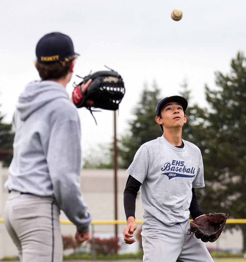 Everett’s Mason Koontz (left) and Corbin Weitenhagen play catch at the end of practice on May 16 at Cascade High School in Everett. (Kevin Clark / The Herald)
