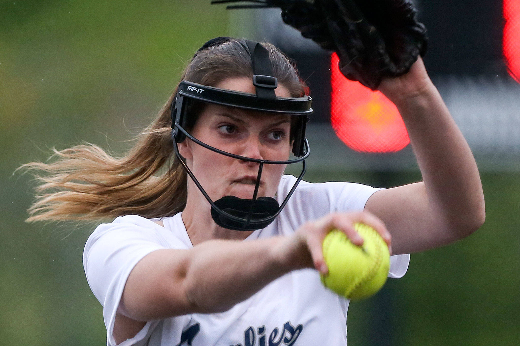 Glacier Peak’s Makayla Miller tosses a pitch during the Grizzlies’ 11-6 loss to Eastlake in a 4A Wes-King Bi-District Tournament semifinal Wednesday at Phil Johnson Ballfields in Everett. (Kevin Clark / The Herald)