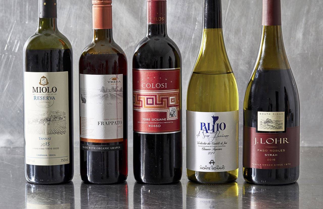 From left: Miolo Reserva Tannat 2015 from Brazil, Feudo di Santa Tresa Frappato 2017 from Sicily, Cantine Colosi Rosso 2016 from Sicily, Terre Monte Schiavo Pallio di San Floriano Verdicchio dei Castelli di Jesi Classico Superiore from Italy and J. Lohr South Ridge Syrah 2016 from Paso Robles, California (Stacy Zarin Goldberg for The Washington Post)