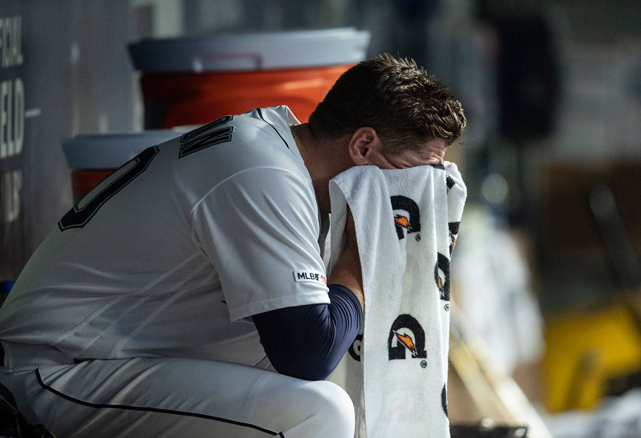 Mariners starting pitcher Erik Swanson sits in the dugout after being removed during the fourth inning of a game against the Twins on May 16, 2019, in Seattle. (AP Photo/Stephen Brashear)