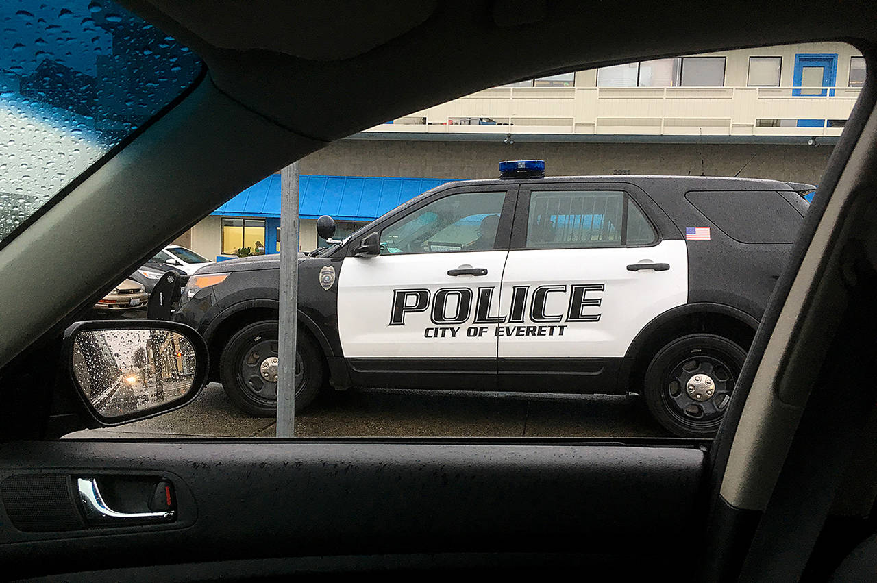 Everett police officers respond to an average of 13 alarms calls each day. (Sue Misao / Herald file)