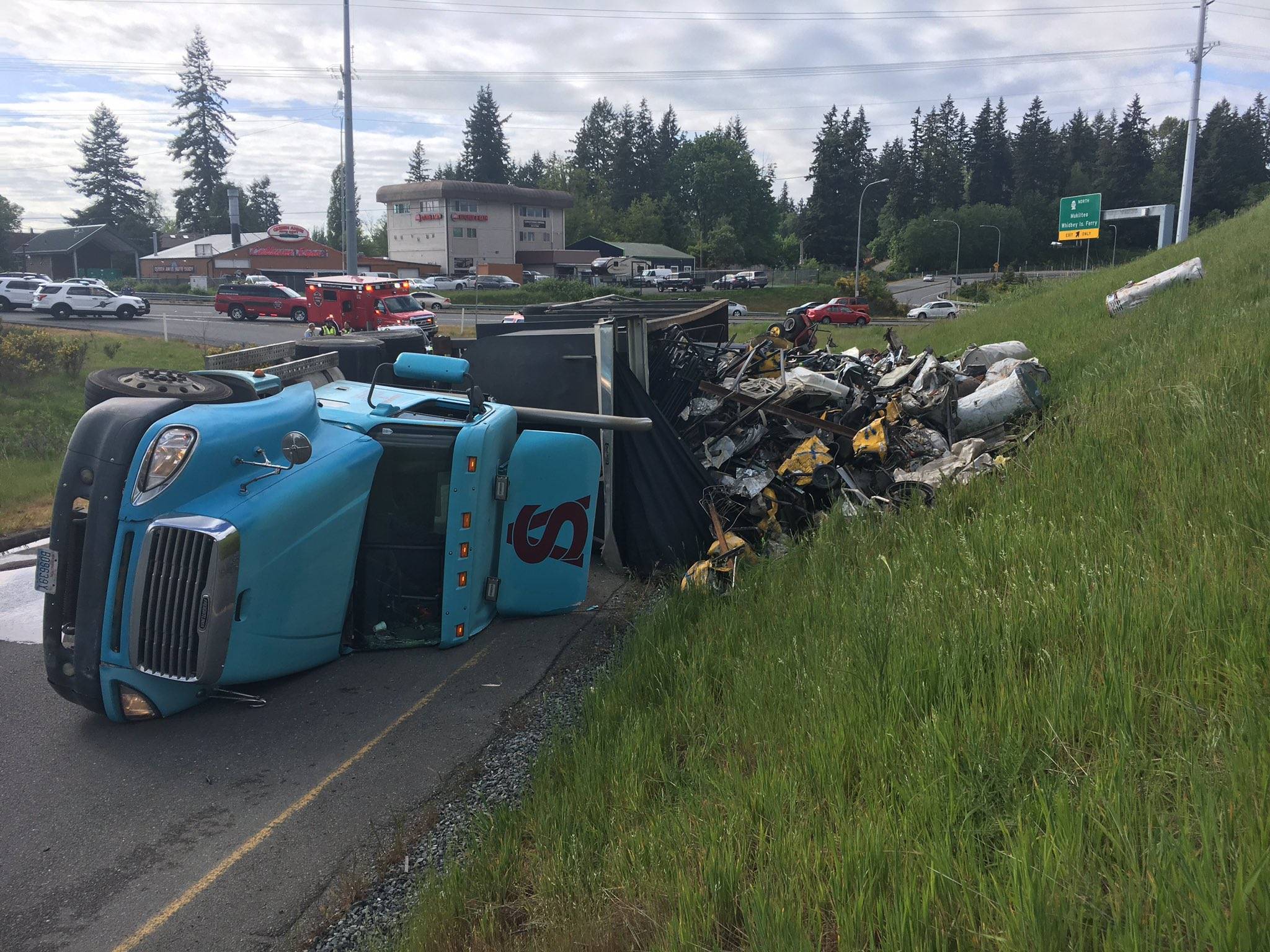 A semi-truck crashed and spilled 100 gallons of diesel on the Highway 99 on-ramp to Highway 525. (Washington State Patrol)