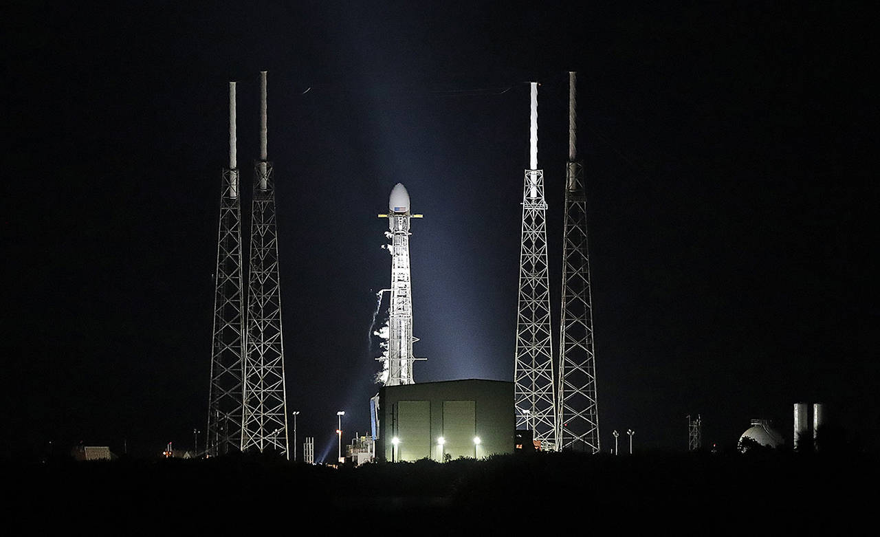 A Falcon 9 SpaceX rocket, with a payload of 60 satellites for SpaceX’s Starlink broadband network, is seen moments after the launch was scrubbed at space launch complex 40 at the Cape Canaveral Air Force Station in Cape Canaveral, Florida, on May 15. (AP Photo/John Raoux)