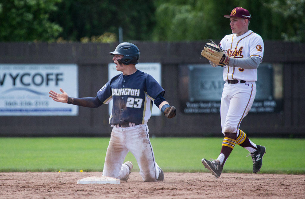 Arlington’s Jack Sheward reacts after being called out at second base after a rundown. (Andy Bronson / The Herald)
