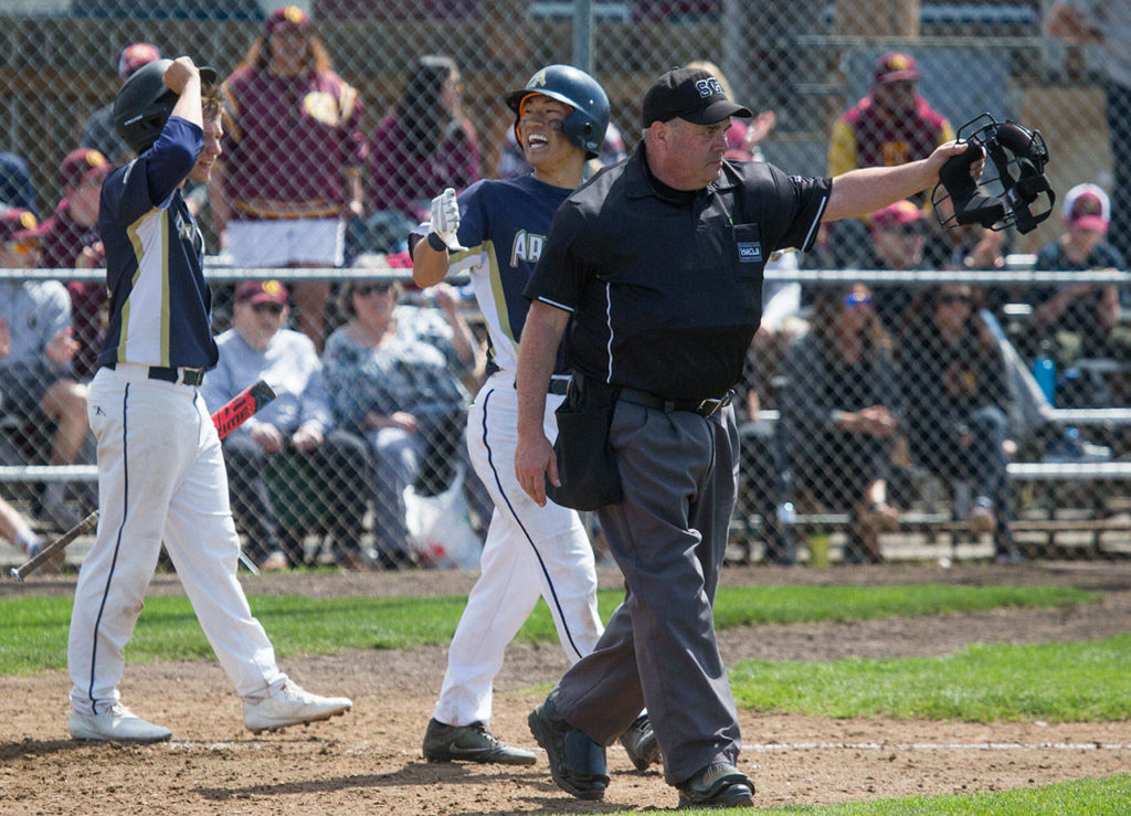 Arlington’s Paul Chung reacts after being told to return to second base on a ground-rule double in the fifth inning. (Andy Bronson / The Herald)
