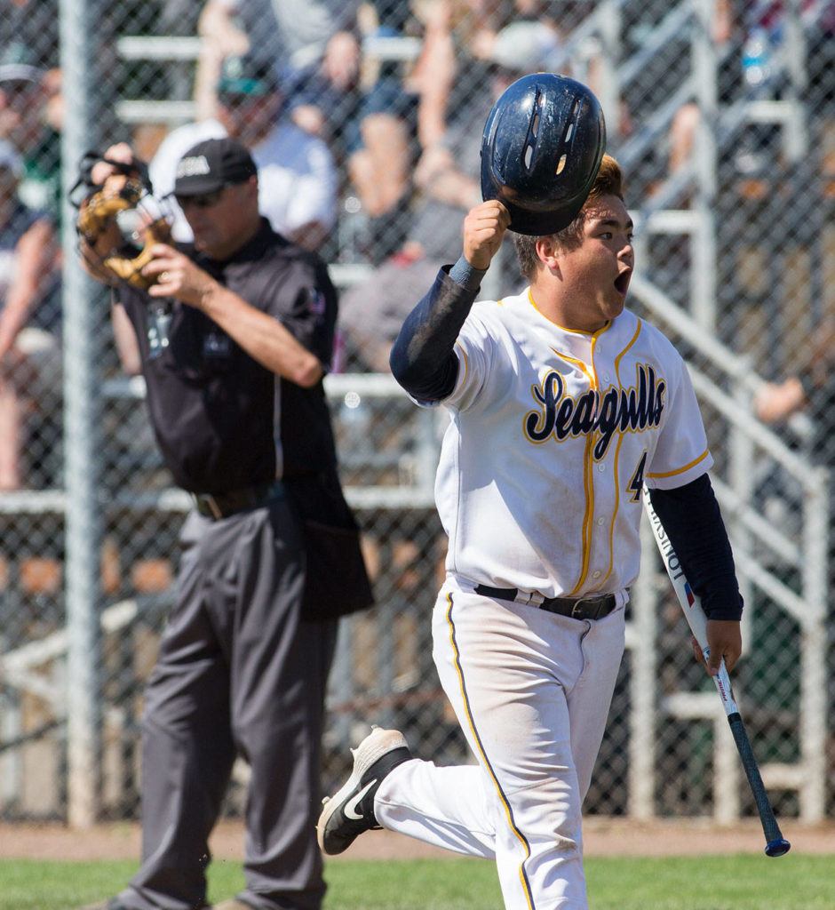 Everett’s Tyler Bates celebrates after scoring the Seagulls’ first run in the sixth inning. (Andy Bronson / The Herald)
