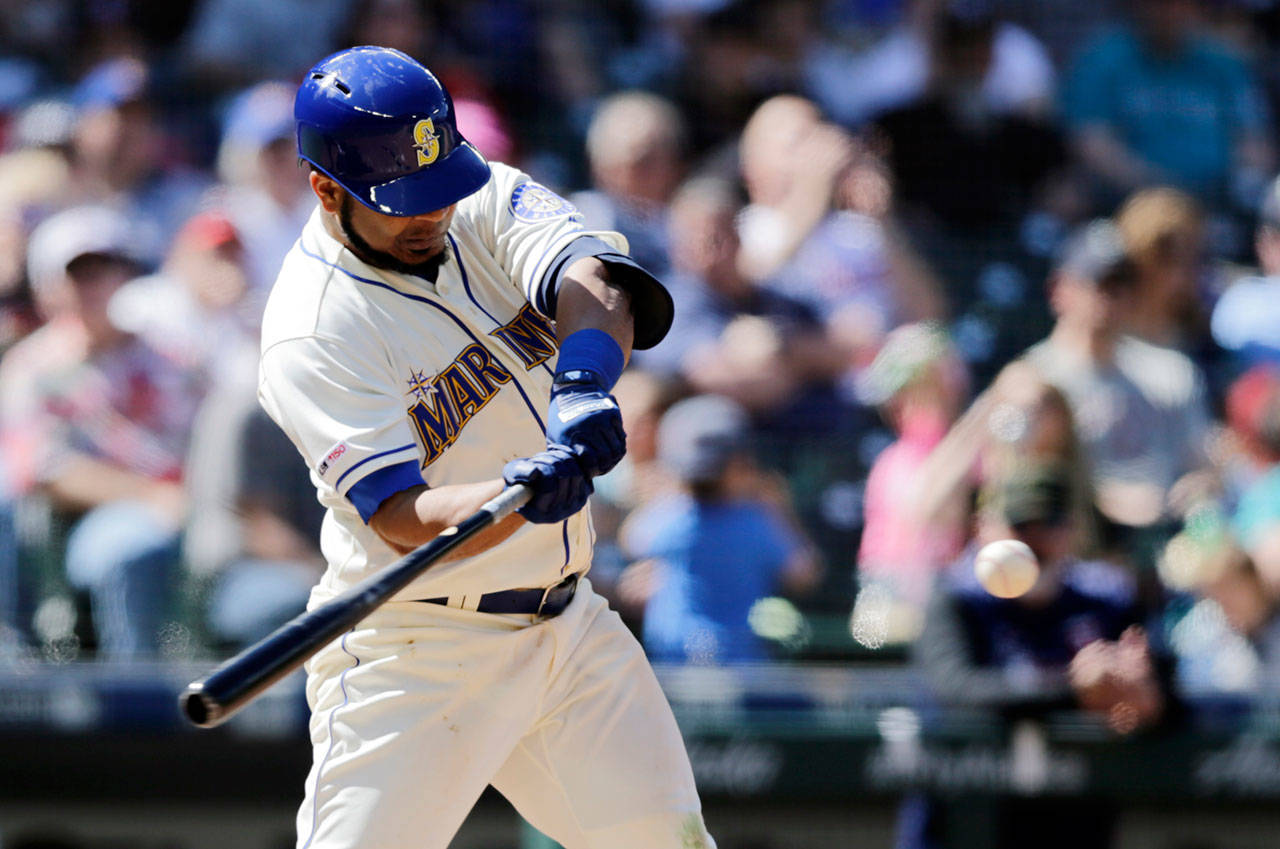 Seattle’s Edwin Encarnacion connects for a three-run home run off Minnesota’s Trevor May during the seventh inning of Sunday’s game in Seattle. (AP Photo/John Froschauer)