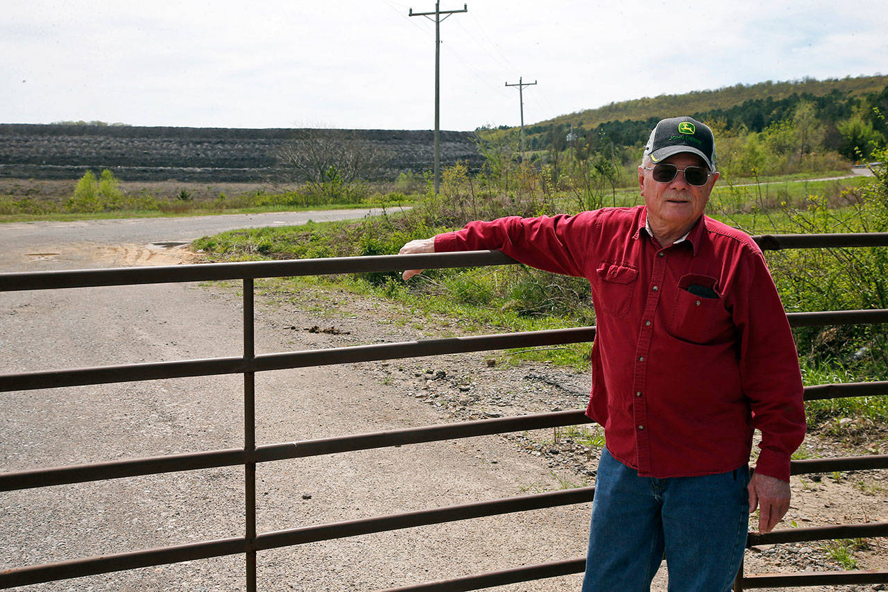 Tim Tanksley, who has been fighting for years trying to convince Oklahoma lawmakers to crack down on the coal ash dumping, stands outside a dump site in Bokoshe, Oklahoma, on April 8. President Donald Trump’s EPA has approved Oklahoma to be the first state to take over permitting and enforcement on coal-ash sites. “They’re going to do absolutely nothing,” Tanksley said. (AP Photo/Sue Ogrocki)