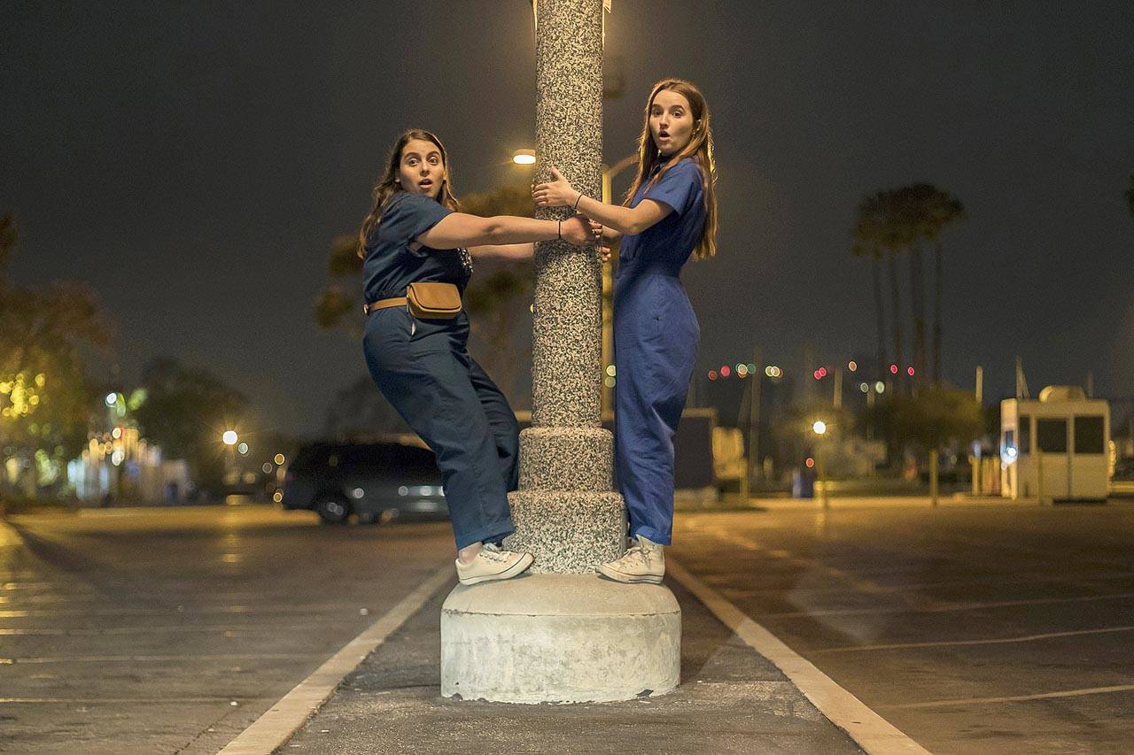 Beanie Feldstein (left) and Kaitlyn Dever play straight-A students who decide to make up for lost partying time in “Booksmart.” (Annapurna Pictures)