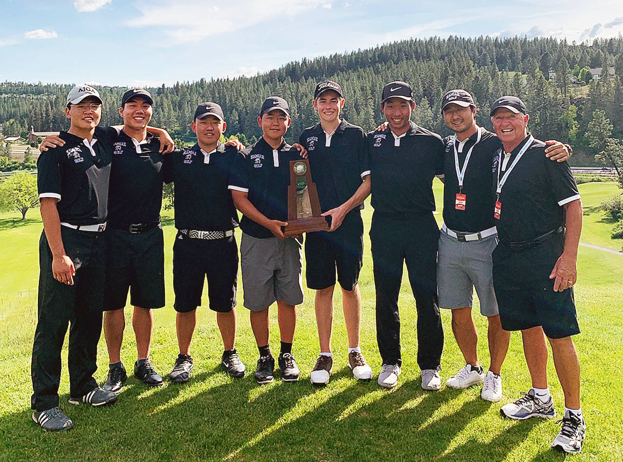 The Kamiak boys golf team celebrates with its trophy after winning the team title at the 4A State Championship on Wednesday at The Creek at Qualchan Golf Course in Spokane. (Photo provided)