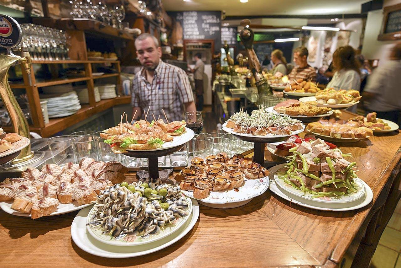 At Basque-style tapas bars, pintxos are already laid out, so you can simply point to or grab what you want. (Rick Steves’ Europe)