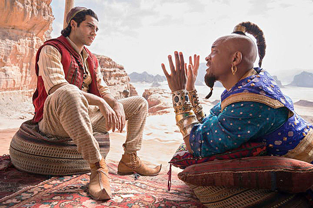 Mena Massoud plays Aladdin and Will Smith is the Genie in the live-action “Aladdin.” (Disney)