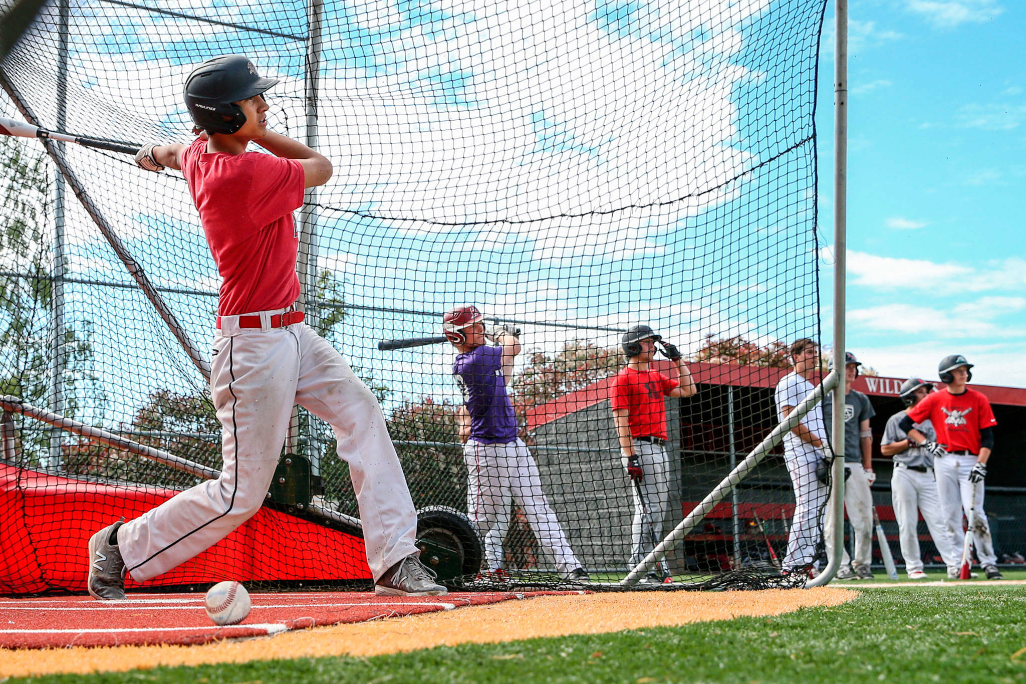 Archbishop Murphy’s Aiden Van Rensum swings in the batting cage during the Wildcats’ team practice Tuesday afternoon in Everett. (Kevin Clark / The Herald)