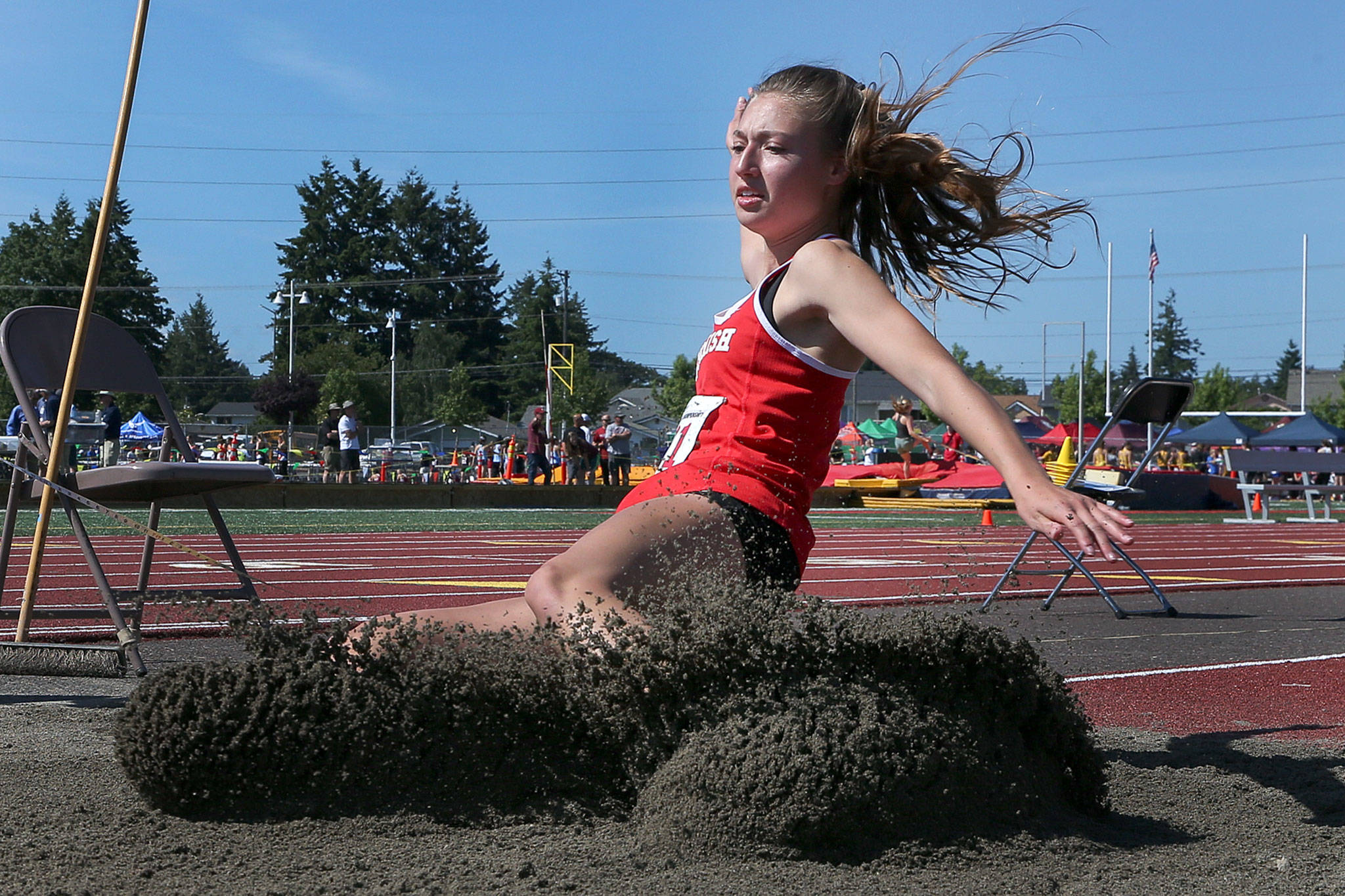 Snohomish’s Bree Nichols lands in the triple jump pit during the first day of competition at the 4A/3A/2A State Track Field Championships on Thursday at Mount Tahoma High School in Tacoma. (Kevin Clark / The Herald)