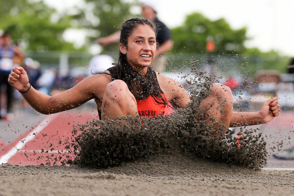 Monroe’s Hannah Ganashamoorthy lands in the long jump pit during the first day of competition at the 4A/3A/2A State Track Field Championships on Thursday at Mount Tahoma High School in Tacoma. (Kevin Clark / The Herald)
