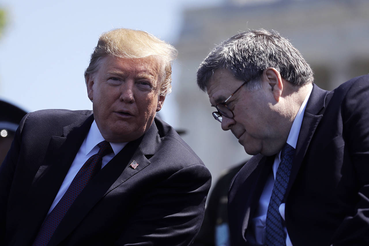In this May 15 photo, President Donald Trump and Attorney General William Barr speak at the 38th Annual National Peace Officers’ Memorial Service at the U.S. Capitol in Washington. (AP Photo/Evan Vucci, File)