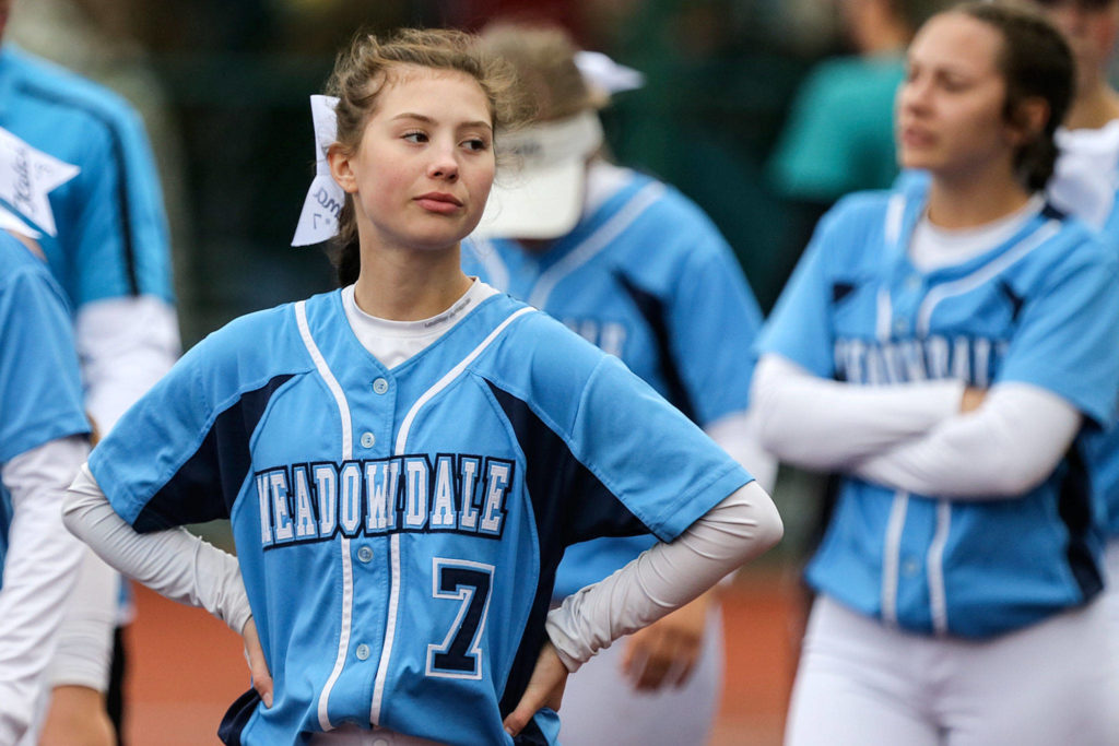 Meadowdale’s Emma Meyer walks off the field dejected with her team after loosing to Bonney Lake Friday afternoon during the 3A Softball State Championship at the Regional Athletic Complex in Lacey. (Kevin Clark / The Herald)
