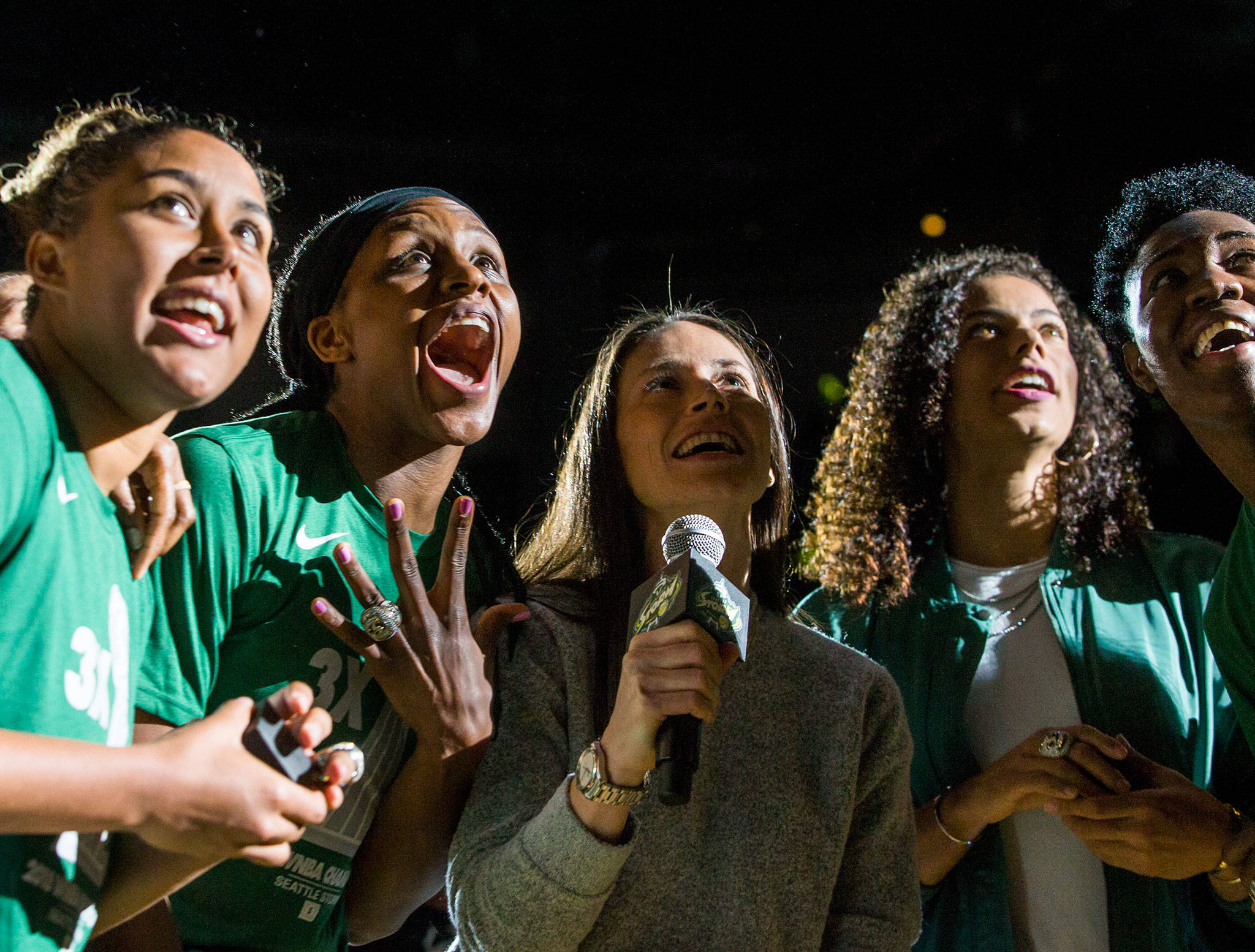 Seattle Storm’s Kaleena Mosqueda-Lewis, Crystal Langhorne, Sue Bird, Alysha Clark, and Natasha Howard react to their championship banner being revealed during the ring ceremony before the season opener game against the Phoenix Mercury on Saturday, May 25, 2019 in Everett, Wash. (Olivia Vanni / The Herald)