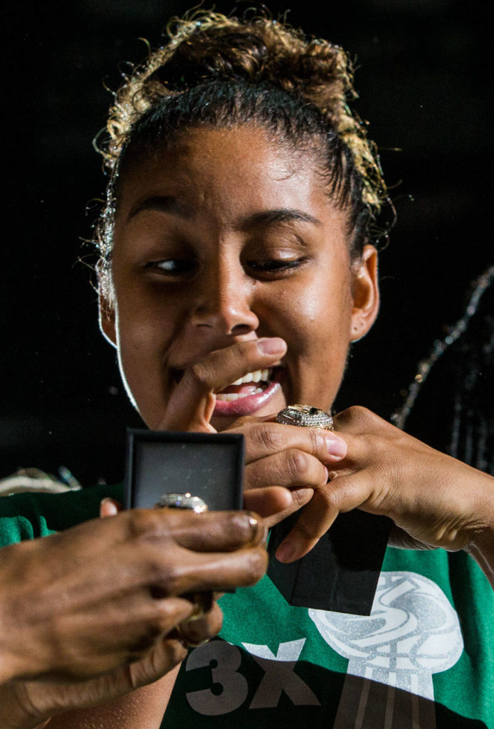 Seattle Storm’s Kaleena Mosqueda-Lewis reacts while looking at her championship ring before the season opener game against the Phoenix Mercury on Saturday, May 25, 2019 in Everett, Wash. (Olivia Vanni / The Herald)
