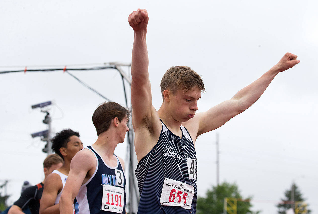 Glacier Peak’s Ethan Willems raises his arms in celebration after winning the 4A boys 400-meter state title. (Andy Bronson / The Herald)