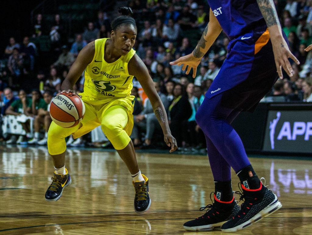 Seattle Storm’s Jewell Loyd dribbles around Phoenix Mercury’s Brittney Griner during the season opener game against the Phoenix Mercury on Saturday, May 25, 2019 in Everett, Wash. (Olivia Vanni / The Herald)
