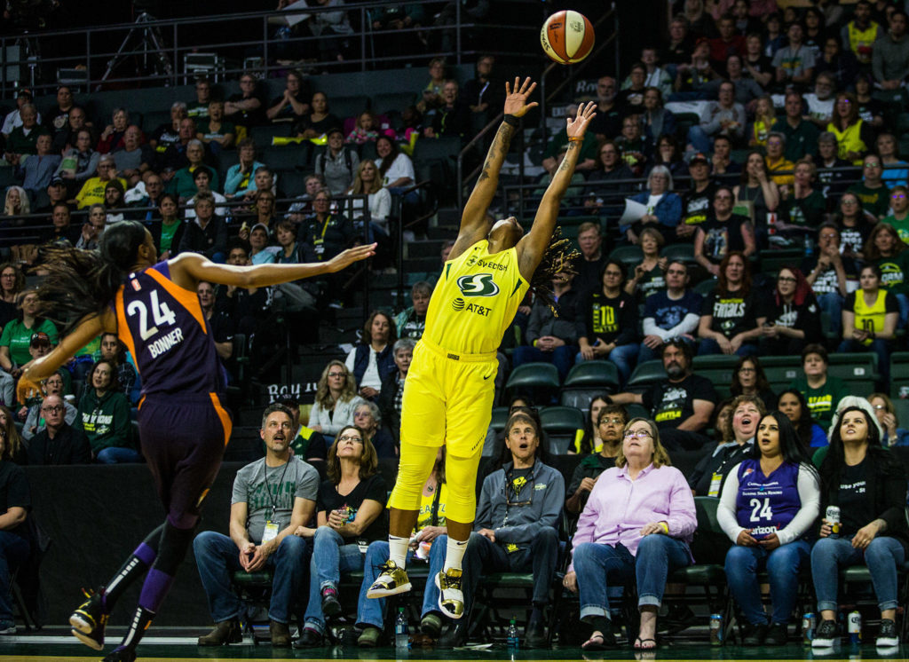 Seattle Storm’s Shavonte Zellous jumps for a high pass during the season opener game against the Phoenix Mercury on Saturday, May 25, 2019 in Everett, Wash. (Olivia Vanni / The Herald)
