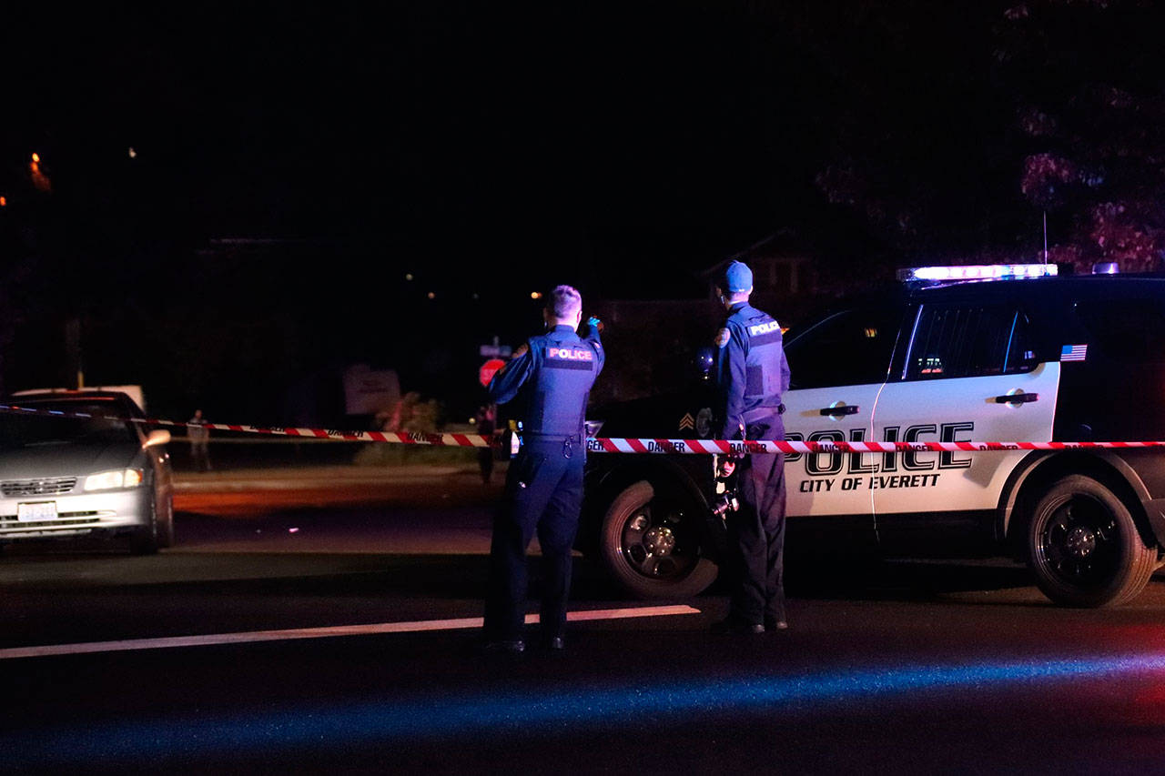 Everett police near Grand Avenue where a woman, who later died, was found in the road Saturday night. (Submitted photo)