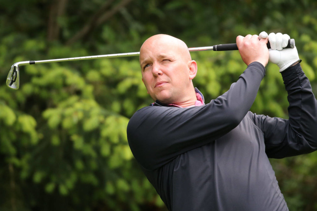 Joe Hardy tees off Sunday afternoon during the second round of the Snohomish County Amateur golf tournament at Harbour Pointe Golf Club in Mukilteo. Hardy shot an even par 72 and was in second place. (Kevin Clark / The Herald)
